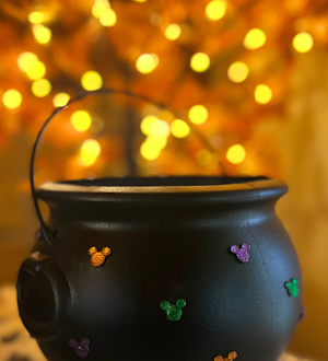 This DIY Disney-inspired Halloween cauldron is covered in Mickey-shaped festive rhinestones.