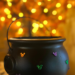 This DIY Disney-inspired Halloween cauldron is covered in Mickey-shaped festive rhinestones.