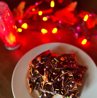 Disney-Inspired Swirled Halloween Bark with Mickey-shaped Halloween sprinkles.