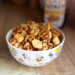 Honey Cereal Snack Mix in an adorable bowl with bees and foliage.