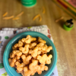 A small blue bowl of Mickey-shaped cheese crackers are the perfect Disney-inspired savory treat.