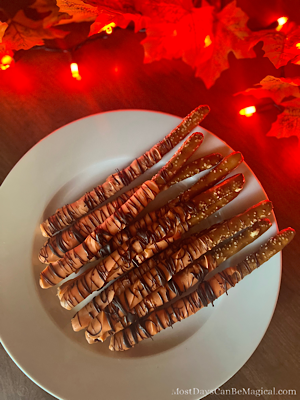 Disney-inspired Tigger-Tail themed Pretzel rods are the perfect Autumn colors for your Halloween party.