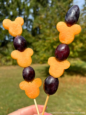 Disney-inspired fruit skewers featuring Mickey-shaped cantaloupe and purple grapes on 6" bamboo fruit skewers will be the healthy hit of the Halloween party!